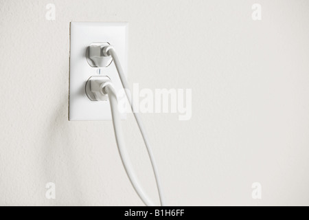 Electrical plug in a socket Stock Photo