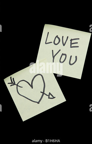 Adhesive notes with a heart and love you on them Stock Photo