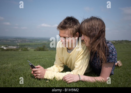 Young couple looking at mobile phone Stock Photo