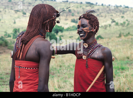 Two Maasai moran warriors greeting each other Masai Mara National ...