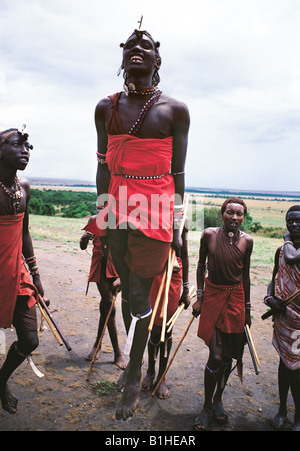 Maasai moran warriors enjoy their famous traditional jumping dance Kenya East Africa Stock Photo