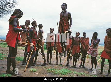 Maasai moran warriors enjoy their famous traditional jumping dance Kenya East Africa Stock Photo