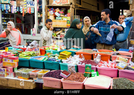 Customers buying bulk goods at the Khan El Khalili market in Cairo Egypt Stock Photo