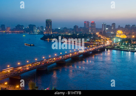 The illuminated 6th October bridge over the Nile river with modern ...