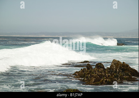 Waves hitting rocks Stock Photo