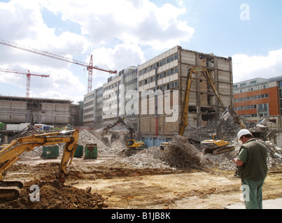 cranes and excavators at a construction site. Demolition of old houses, Germany, Saxony, Leipzig Stock Photo