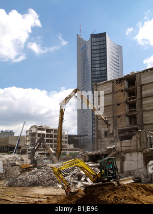 cranes and excavators at a construction site. Demolition of old houses, Germany, Saxony, Leipzig Stock Photo