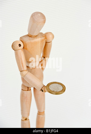 jointed doll with Euro coin Stock Photo