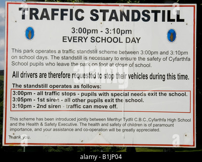 Notice in the grounds of Cyfarthfa Castle and Museum referring to traffic restrictions for Cyfarthfa School on the same site. Stock Photo