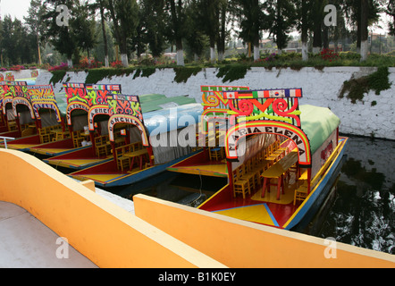 Colourful Trajinera Boats on the Canals of the Floating Gardens of Xochimilco Mexico City Stock Photo