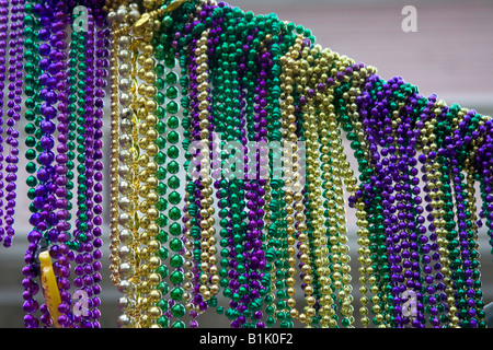 Mardi Gras beads gathered together on the streets of New Orleans. Stock Photo