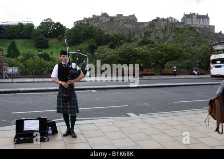 Bagpiper playing in princes street, Edinburgh Stock Photo