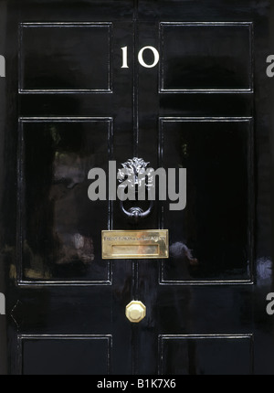 10 Downing Street close up  black door ten number knocker letter box flap & door knob ironmongery on official residence of UK Prime Minister in London Stock Photo