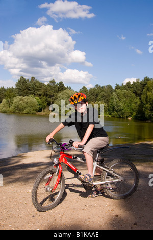 Boy On Bike At Center Parcs at Elveden near Thetford,Uk Stock Photo