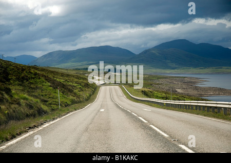 Empty Open Road, the A835 to Ullapool from Inverness, with Loch Glascarnoch, North West Highland Scotland, on the north coast 500 Stock Photo