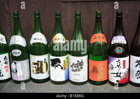 Saki bottles on display outside restaurant in Tokyo Japan Stock Photo