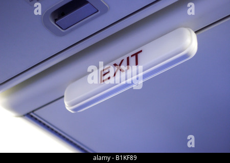 Exit sign on airplane Stock Photo