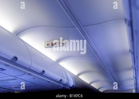 Exit sign on airplane Stock Photo