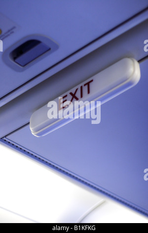 Exit sign on airplane Stock Photo