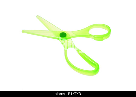 Green plastic scissors on white background Stock Photo