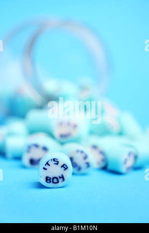 A jar of rock with 'its a boy' running through it Stock Photo