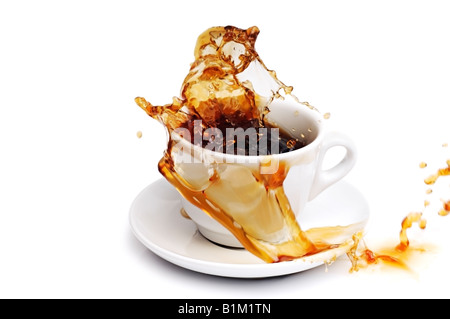 Coffee Spilling from a Cup Against a White Background Stock Photo