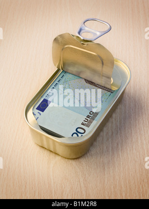 Ring Pull Tin containing 20 Euro notes on wooden surface - Concept Stock Photo