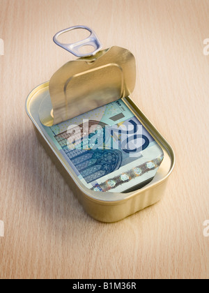 Ring Pull Tin containing 20 Euro notes on wooden surface - Concept Stock Photo