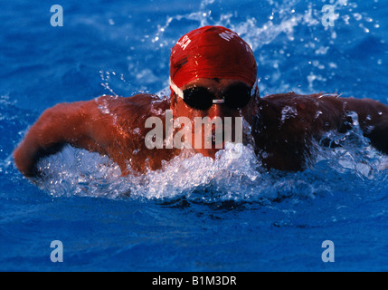 Sport. Close-up of male swimmer in swimming race. Butterfly stroke. Stock Photo
