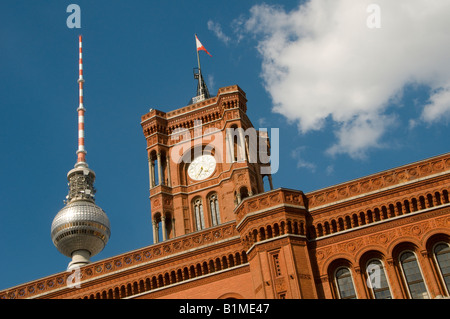 The Berliner Rote Rathaus Red Town hall with the Fernsehturm communication antenna Mitte Quarter Scheunenviertel Berlin Germany Stock Photo