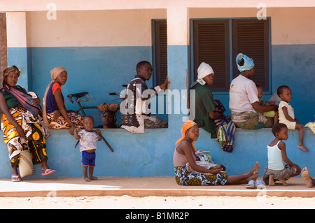 Waiting patients in front of a small clinic in Muxara, near Pemba. Mozambique. Stock Photo