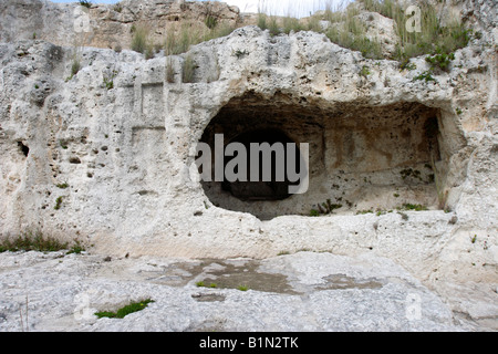 A niche cut into the rock above the ancient Greek theatre in Syracuse ...