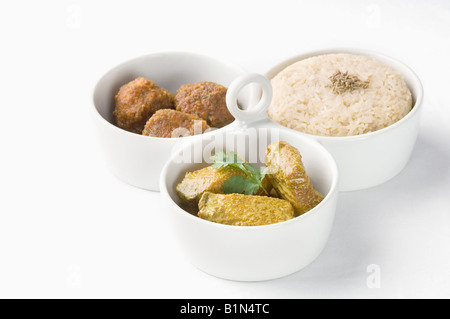 Close-up of koftas curry and boiled rice with meatballs in bowls Stock Photo