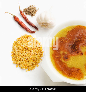 Close-up of lentil soup served in a bowl with its ingredients Stock Photo