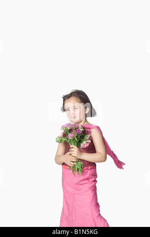 Portrait of a girl holding a bunch of flowers Stock Photo - Alamy