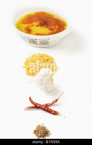 Close-up of lentil soup served in a bowl with its ingredients Stock Photo