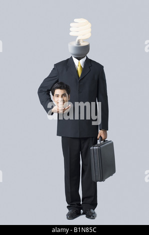 Businessman with a light bulb on his head Stock Photo