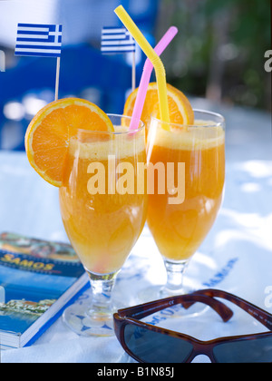 Orange juice drinks in a Greek tavern Stock Photo