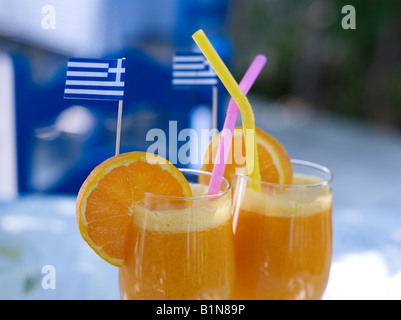 Orange juice drinks in a Greek tavern Stock Photo