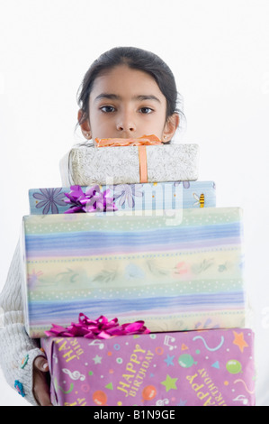 Portrait of a girl holding presents Stock Photo