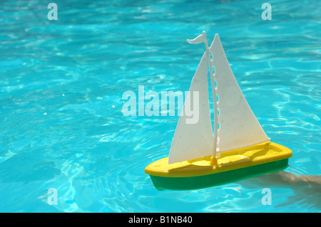 Toy boat in the water Stock Photo