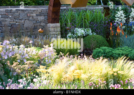 mixed planting in a large flower bed Stock Photo