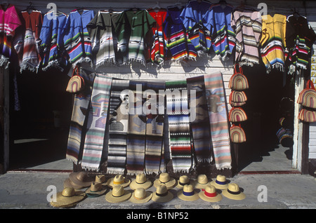 Mexican outdoor market selling hand made local Mexican blankets woven items and hats etc Mexico Stock Photo