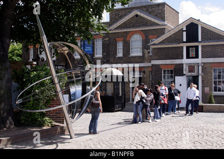 Tourists photographing eachother at the Prime Meridian Line Royal Observatory Greenwich June 2008 Stock Photo