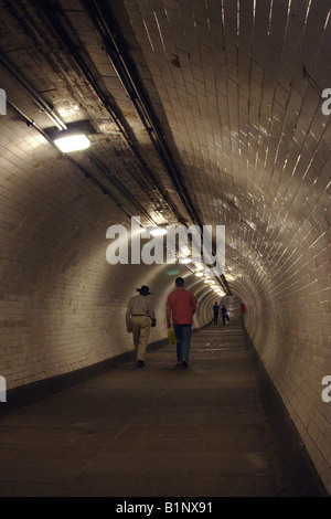 Pedestrians walking through Greenwich Foot Tunnel London Stock Photo