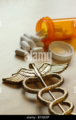Medical concept caduceus and pill bottle Stock Photo