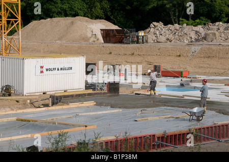 Builders work at a construction site operated by Wolff & Müller one of the top ten German construction companies, Tiergarten quarter Berlin Germany Stock Photo