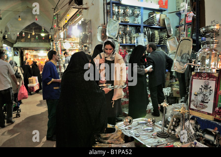 Iranian men and women shopping in the crowded  Bazar e Bozorg Great Bazaar is one of the highlights of Esfahan Iran