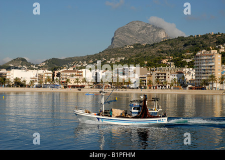 fishing boat leaving the port, Javea / Xabia, Alicante Province, Comunidad Valenciana, Spain Stock Photo