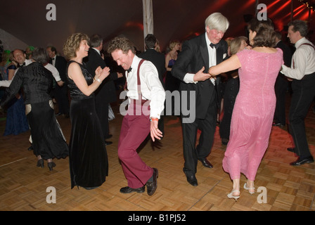 Posh private dance party nightclub held in interior marquee tent Home Counties UK 2000s Woman in cocktail dress black tie event. 2008  HOMER SYKES Stock Photo